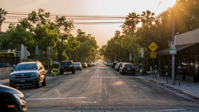 Cars parked in a small urban road typical of local rental operations in Los Angeles