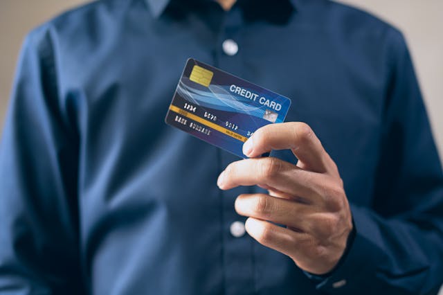 man holding credit card