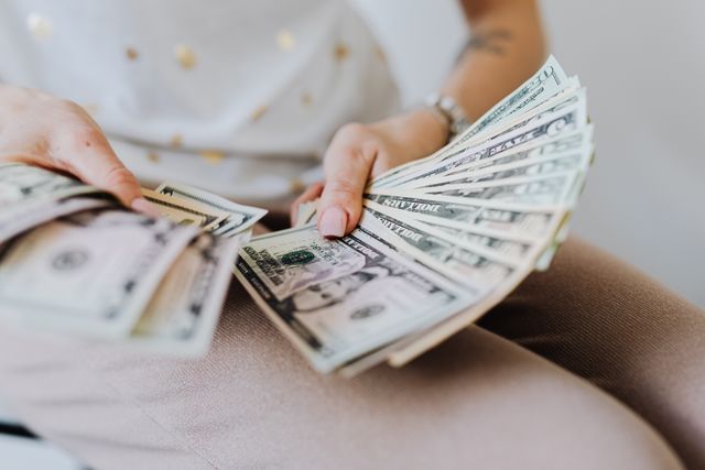 woman fanning out cash