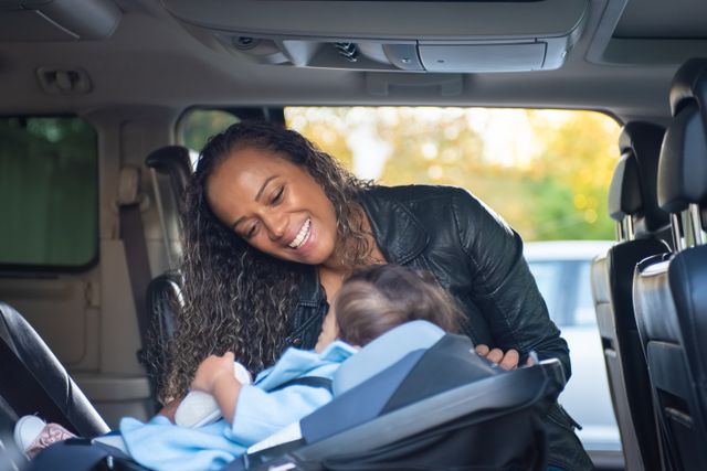 baby in a child seat in a rental car